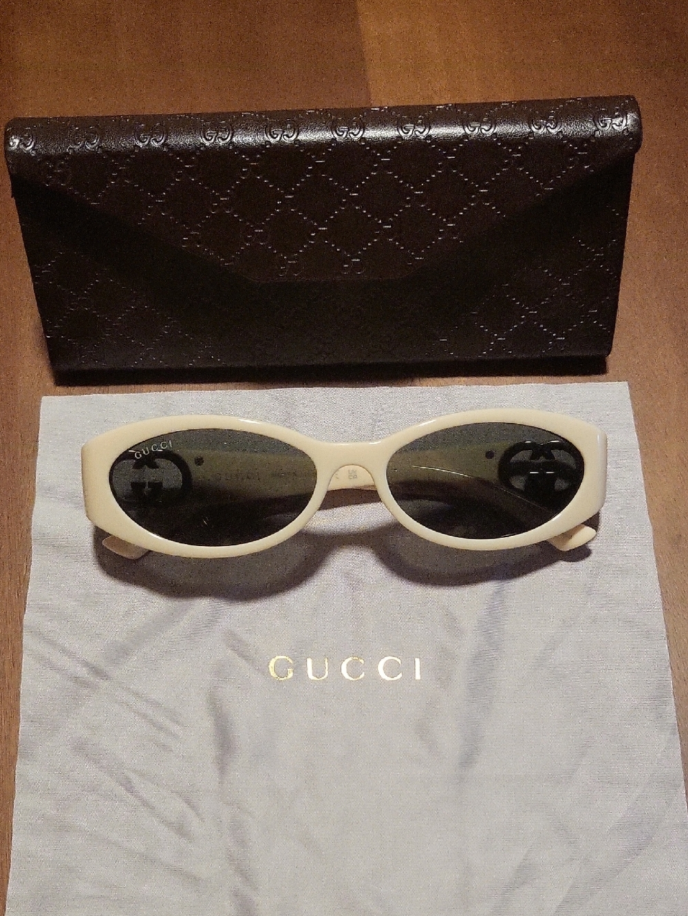 Gucci Ivory Oval Women's Sunglasses with Dark Lenses